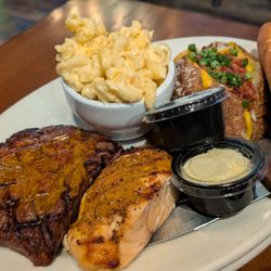 Rusty Bull Roadhouse - Delicious steak and salmon with Mac & cheese, and a loaded baked potato!