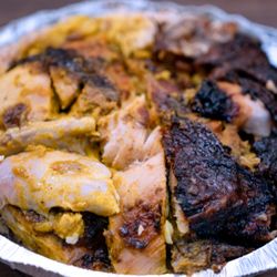 Island Choiz - Jerk Chicken Meal, Medium: $14. Shown with curry chicken gravy. Take-out.