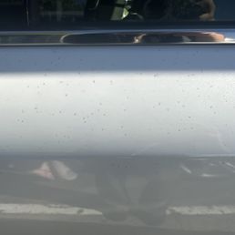 Stains speckled all over car, under wax and sealer. Impossible to remove now.