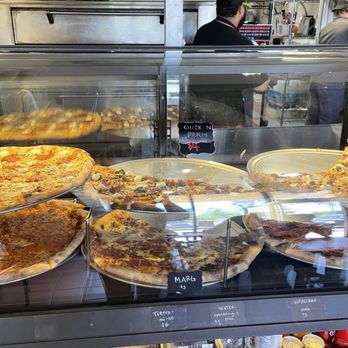 The Pizza Standard - Pizza case of their hot and ready options - Pizza Near Me - San Diego, California The Pizza Standard - Pizza case of their hot and ready options - Pizza Near Me - San Diego, California