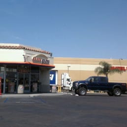 a car parked in front of a gas station