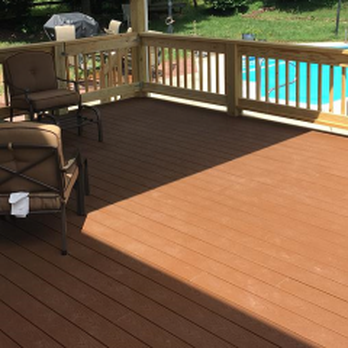 Eddinger Construction - a deck with chairs and a table - General Contractors Near Me - Thomasville, North Carolina