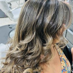 Blonde balayage on natural brunette with butterfly haircut. Blonde balayage on natural brunette with butterfly haircut.
