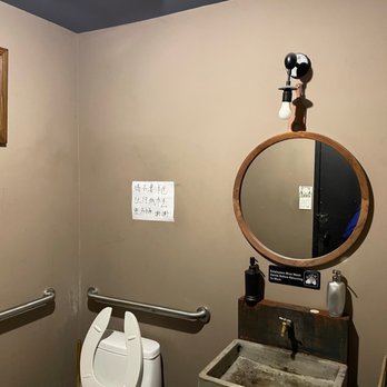 Alley 41 - a bathroom with a toilet, sink and mirror - Asian Fusion Near Me - Flushing, New York Alley 41 - a bathroom with a toilet, sink and mirror - Asian Fusion Near Me - Flushing, New York