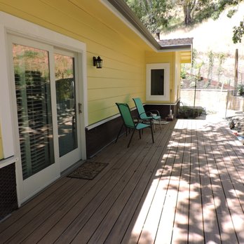 Mill Creek Builders - a deck with chairs and a table - General Contractors Near Me - Martinez, California Mill Creek Builders - a deck with chairs and a table - General Contractors Near Me - Martinez, California