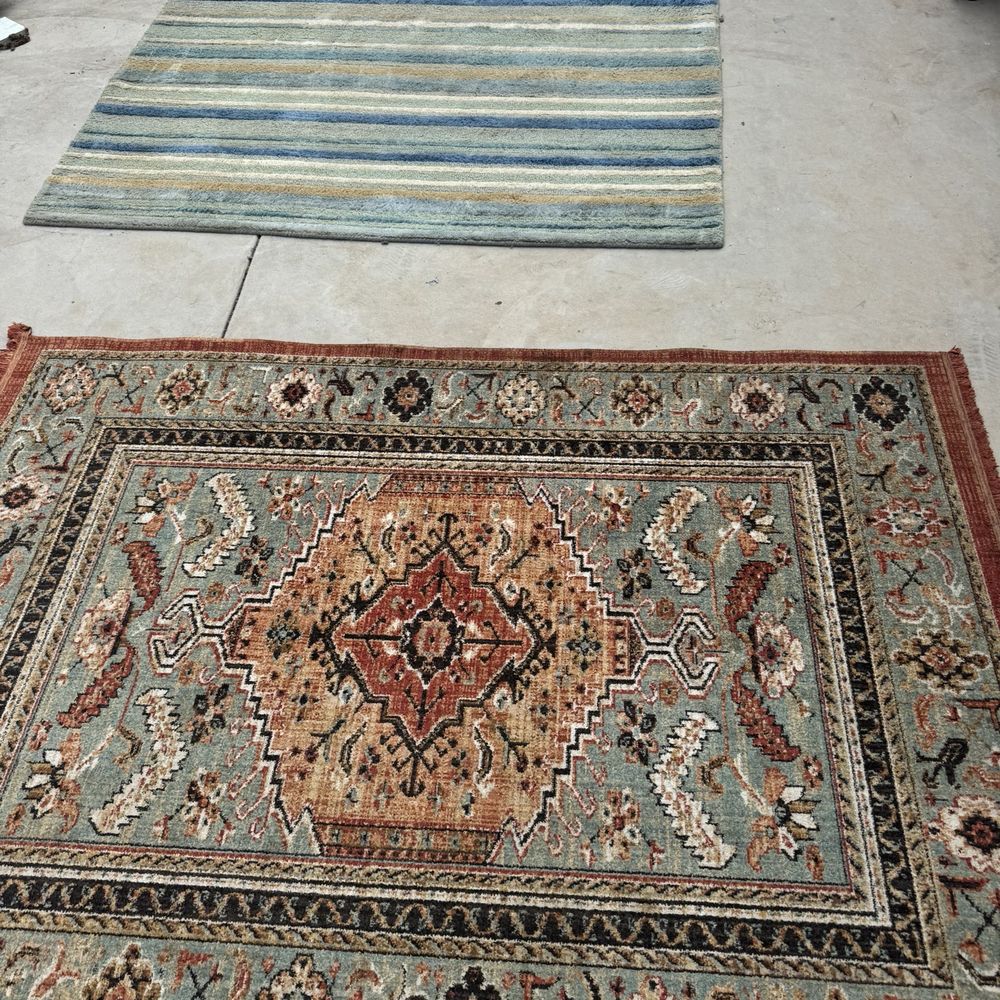 Maui Steamers - The blue rug in back is wool and was pretty dirty. The patterned rug in front is a low-quality rug, but he did a good job cleaning it up! - Carpet Cleaning Near Me