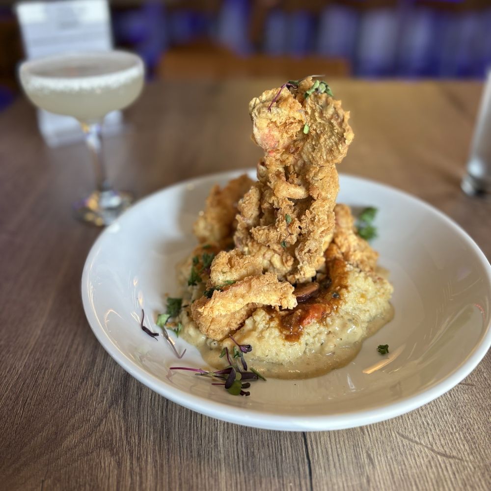 Pure Social Bar & Grill - Lobster, shrimp & grits with crawfish cream sauce and andouille & a lemon drop during brunch - Sports Bars Near Me - Richardson, Texas Pure Social Bar & Grill - Lobster, shrimp & grits with crawfish cream sauce and andouille & a lemon drop during brunch - Sports Bars Near Me - Richardson, Texas