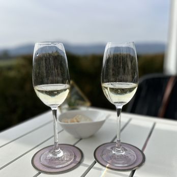 Mumm Napa - two glasses of wine on a table - Wine Tasting Room Near Me - Rutherford, California Mumm Napa - two glasses of wine on a table - Wine Tasting Room Near Me - Rutherford, California