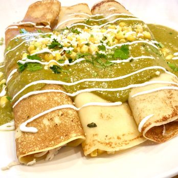 Broken Yolk Cafe - Savoy Crepes with shredded chicken, corn, jack cheese topped with poblano sauce, corn and cotija cheese - Breakfast & Brunch Near Me - Costa Mesa, California