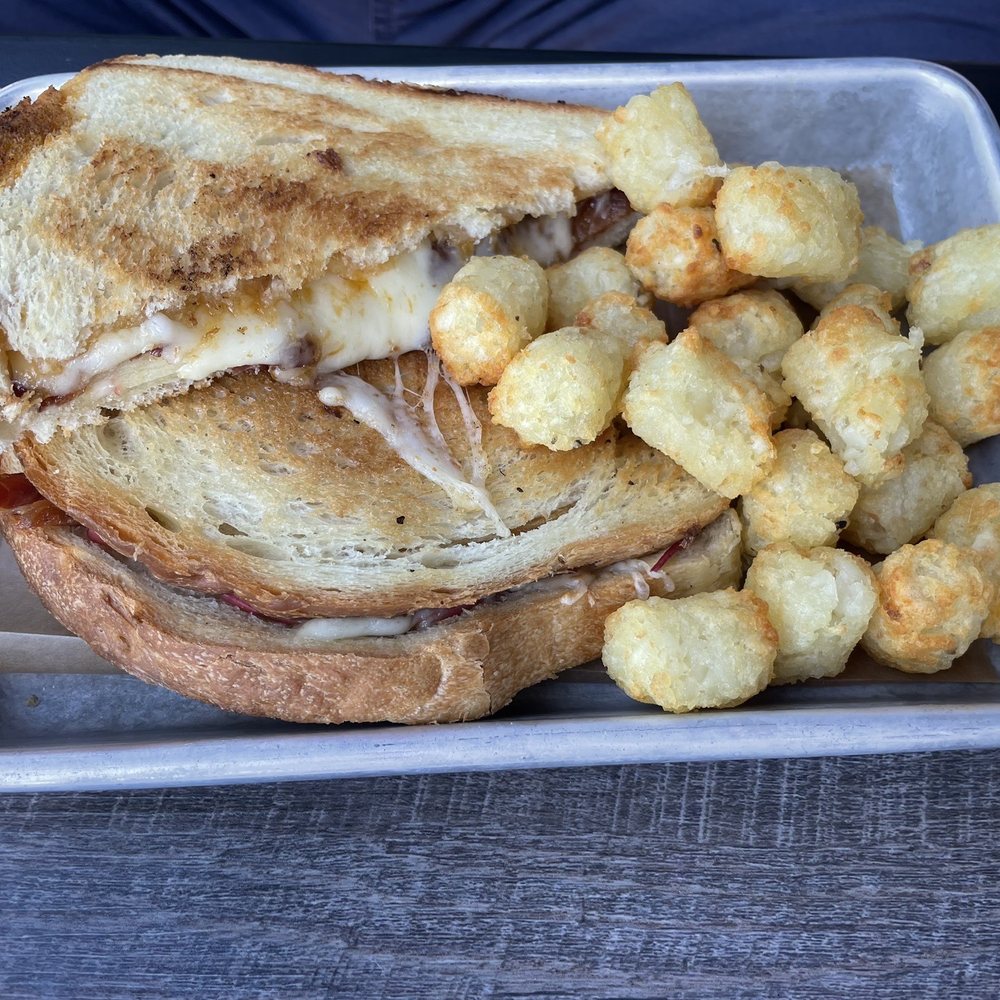 Taproot Cider House - Grilled Cheese with spuds (tater tots) - Bars Near Me - Traverse City, Michigan Taproot Cider House - Grilled Cheese with spuds (tater tots) - Bars Near Me - Traverse City, Michigan