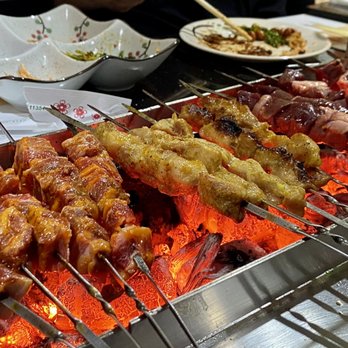 Jin Da Lai - New batch of skewers on the grill - Korean Near Me - Flushing, New York Jin Da Lai - New batch of skewers on the grill - Korean Near Me - Flushing, New York