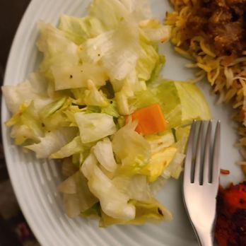 Kabobistan - Iceberg lettuce "salad" with one sliver of carrot and a lot of dressing, but nothing else. - Afghan Near Me - Annandale, Virginia