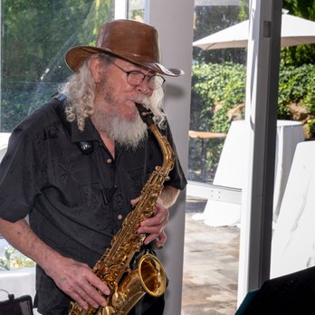Joy Cleaners and Tailors - Tex on the Alto Saxophone - Dry Cleaning Near Me - Islip Terrace, New York Joy Cleaners and Tailors - Tex on the Alto Saxophone - Dry Cleaning Near Me - Islip Terrace, New York