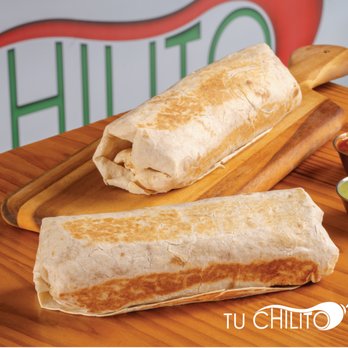 Tacos Tu Chilito - two burritos on a cutting board - Tacos Near Me - North Richland Hills, Texas Tacos Tu Chilito - two burritos on a cutting board - Tacos Near Me - North Richland Hills, Texas