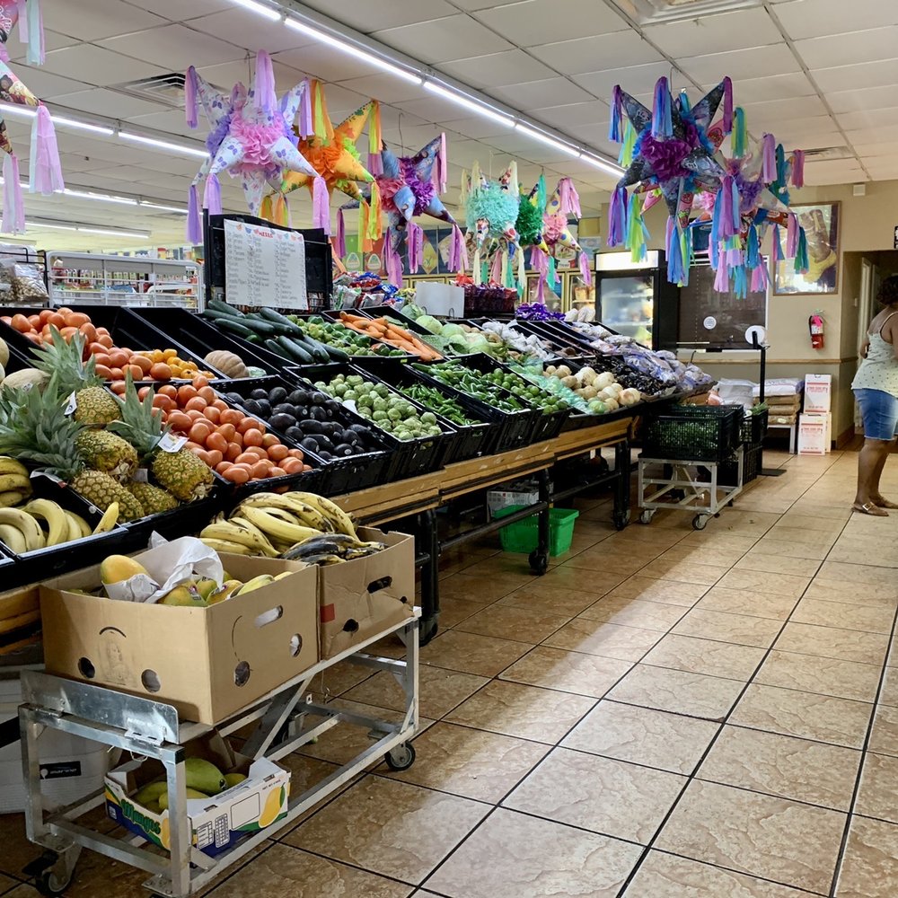 people shopping in a grocery store people shopping in a grocery store
