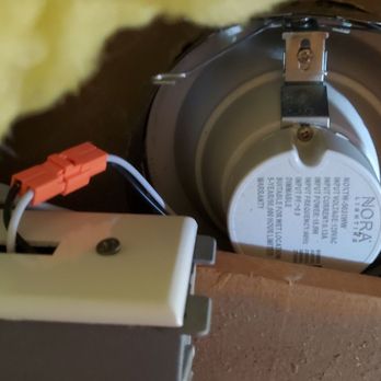 Next Level Lighting & Electric - Recessed light installed without insulating cover in violation of building code. Wrong type of cover plate installed on electrical box. - Electricians Near Me