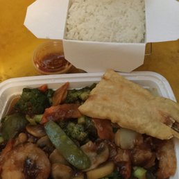 The triple with garlic sauce, fantail shrimp, white rice and hot oil