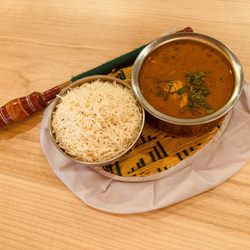 Haveli Indian Cuisine - A Haveli classic! Tender chicken slow-cooked in a bold, aromatic curry sauce with our signature house spice blend.
