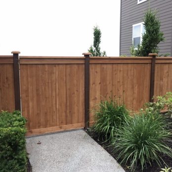 TH General Engineering - a wood fence with a gate - General Contractors Near Me