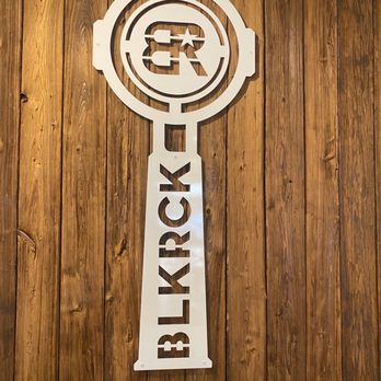 Black Rock Coffee Bar - a clock on a wooden wall - Coffee & Tea Near Me - Vancouver, Washington