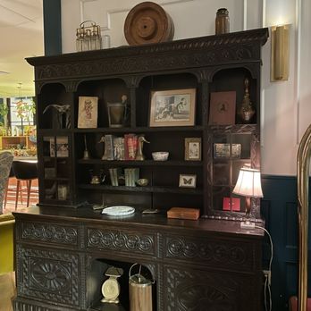 ARRIVE Memphis - Front entrance antique hand carved furniture piece - Hotels Near Me - Memphis, Tennessee