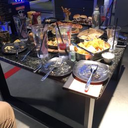 Table with various appetizer foods