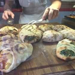 Pizza & Sfizi - Potato and hot dog on the left. Spinach ricotta on the right.