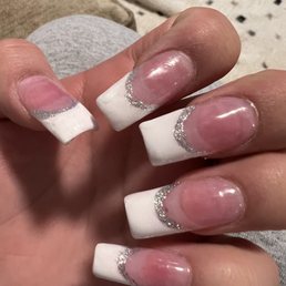 Poorly done acrylic nails. Poorly done acrylic nails.