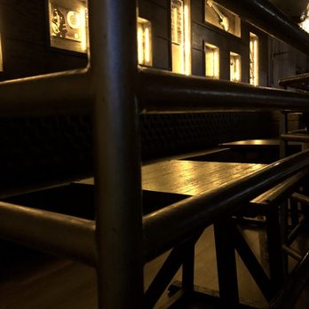 The Strand - a row of tables and benches in a restaurant - Music Venues Near Me - Providence, Rhode Island