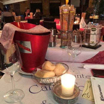 Caffe' Torino - Table with wine and bread with a nice candle - Bars Near Me - Stresa, VB