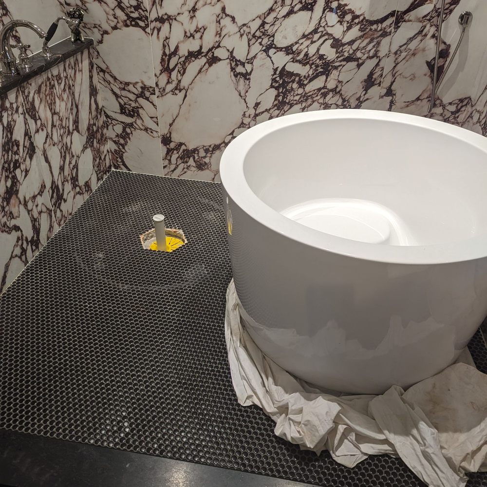 Aqua Vitae Plumbing - Tore the tub and tile up to set a drain flange - Plumbing Near Me - Saint Louis, Missouri