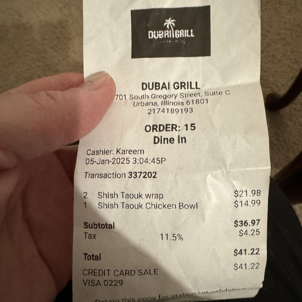 Dubai Grill - This is the receipt showing the price of the two chicken wraps being overcharged, and it's also shows the sales tax which is incorrect - Middle Eastern Near Me - Urbana, Illinois