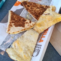 Imaginary cheese burnt quesadilla, peeled a slice open to showcase all that gooey goodness inside!