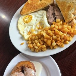 Eggs over medium, hash brown , Brisket , toast, fried donut Eggs over medium, hash brown , Brisket , toast, fried donut