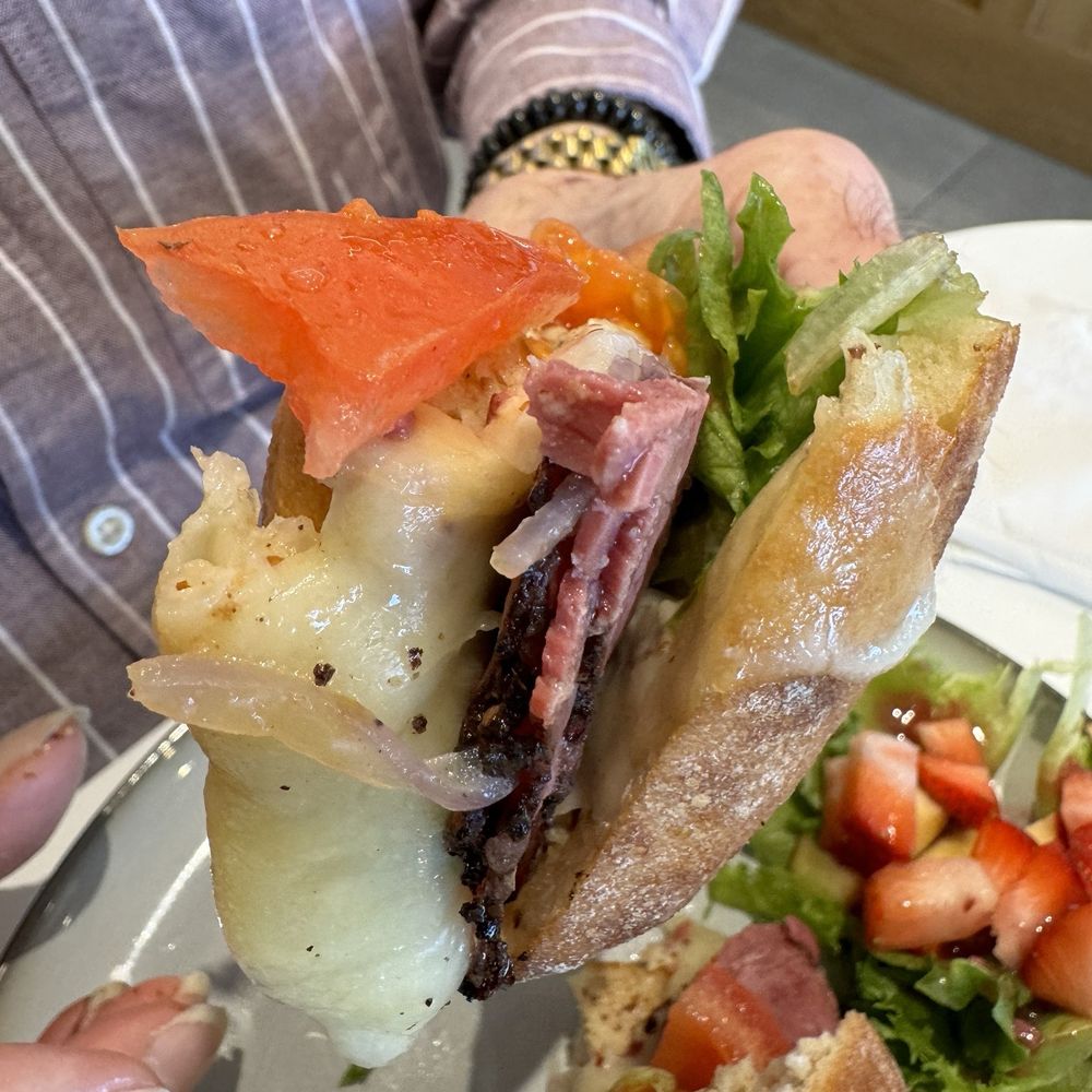 Panicafé - Angus Pastrami sandwich ordered with extra cheese, mustard and onion. - Bakeries Near Me - Spring, Texas Panicafé - Angus Pastrami sandwich ordered with extra cheese, mustard and onion. - Bakeries Near Me - Spring, Texas