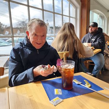 The Corner Cafe - Enjoying ice team in front of the bright and sunny window. - Breakfast & Brunch Near Me - Marshfield, Massachusetts