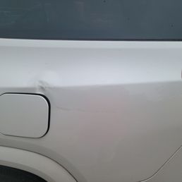 The damage is from back to front. There is a foot long brown scrape before the dent. The damage is from back to front. There is a foot long brown scrape before the dent.