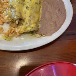 Enchiladas Suizas with beans and rice were full of shredded chicken and cheese.
