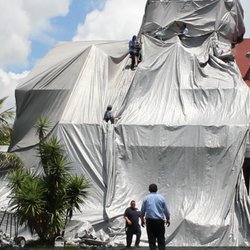 Beach Environmental - David Sprague Jr. directing service for the Former USCG Station on Peanut Island. We make custom tents to fit perfectly and secure.