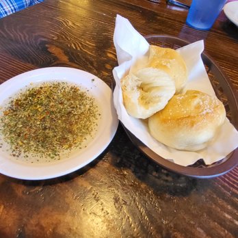 Roma's Italian Kitchen - Garlic knots with olive oil blend... fabulous start to the incredible meal. - Italian Near Me - Longview, Texas Roma's Italian Kitchen - Garlic knots with olive oil blend... fabulous start to the incredible meal. - Italian Near Me - Longview, Texas