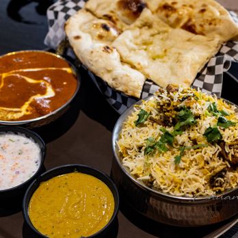 Indraprastha Indian Kitchen & Bar- Downtown - Butter Chicken ($16.99), Butter Naan ($3.49), Chicken Dum Biryani ($14.99) with 2 dipping sauces - Indian Near Me - Toronto, Ontario Indraprastha Indian Kitchen & Bar- Downtown - Butter Chicken ($16.99), Butter Naan ($3.49), Chicken Dum Biryani ($14.99) with 2 dipping sauces - Indian Near Me - Toronto, Ontario