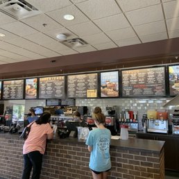 two people standing at the counter