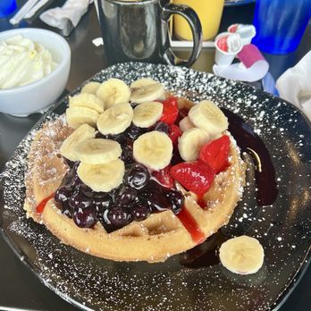 Wally Waffle - The Patriot Waffle has blueberries, strawberries and bananas! So good! Choose to have whipped cream on side! - Breakfast & Brunch Near Me - Akron, Ohio Wally Waffle - The Patriot Waffle has blueberries, strawberries and bananas! So good! Choose to have whipped cream on side! - Breakfast & Brunch Near Me - Akron, Ohio