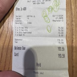 a hand holding a receipt a hand holding a receipt