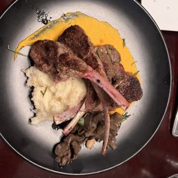Espresso rubbed lamb lollipops with carrot, potato, poached oyster mushrooms and candied rosemary.