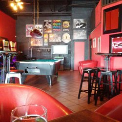 BLVD Bar & Grill - The lotto machines, pool table, dart board, golf game area
