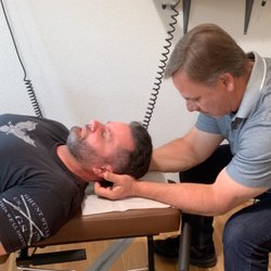 Doble Chiropractic & Upper Cervical Care - Dr Doble is giving a chiropractic adjustment.