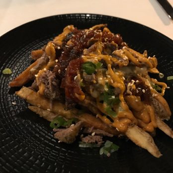District Kitchen - Arirang Poutine - fried topped w/ cheese, kimchi, bulgogi, drizzled with gojuchang aioli. $12 as of 4/2017 - Chinese Near Me - Malden, Massachusetts District Kitchen - Arirang Poutine - fried topped w/ cheese, kimchi, bulgogi, drizzled with gojuchang aioli. $12 as of 4/2017 - Chinese Near Me - Malden, Massachusetts