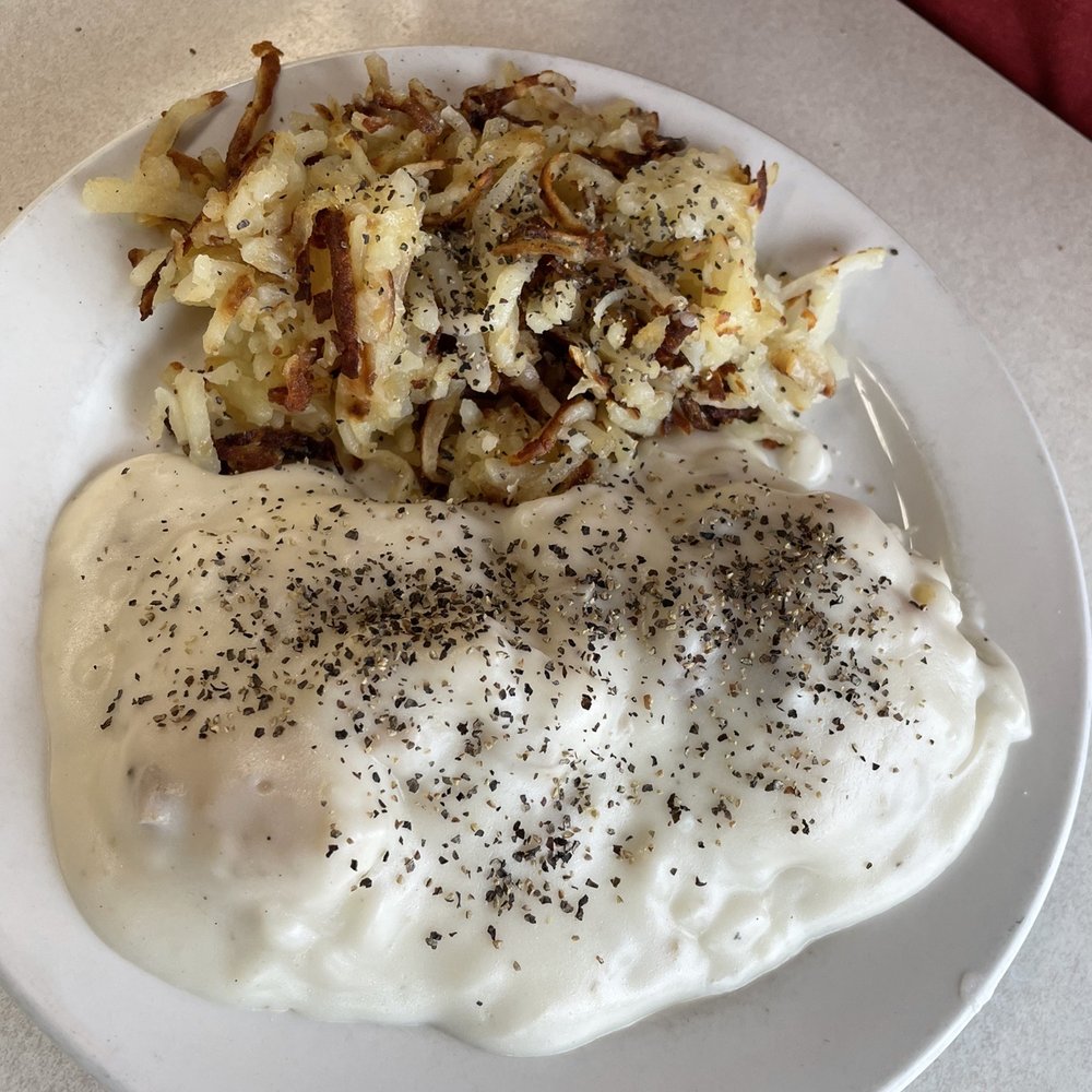 Flap-Jacks Restaurant - Biscuits and gravy and hash browns. Not that much pepper comes on them, I didn't beat my husband to take the photo. - New American Near Me - Brownsburg, Indiana