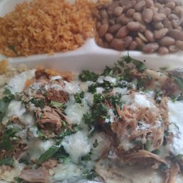 Carnitas tacos with Mexican rice and pinto beans..mouth watering Carnitas tacos with Mexican rice and pinto beans..mouth watering